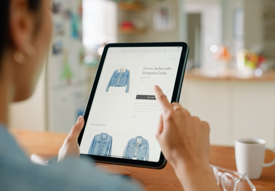 A person browsing an online store on a tablet.